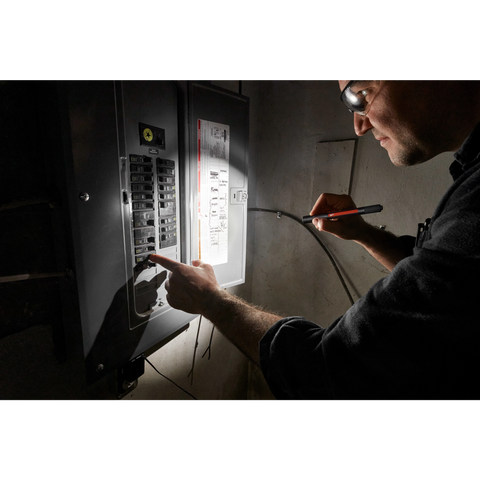 Milwaukee 2010R rechargeable penlight illuminating an electrical panel